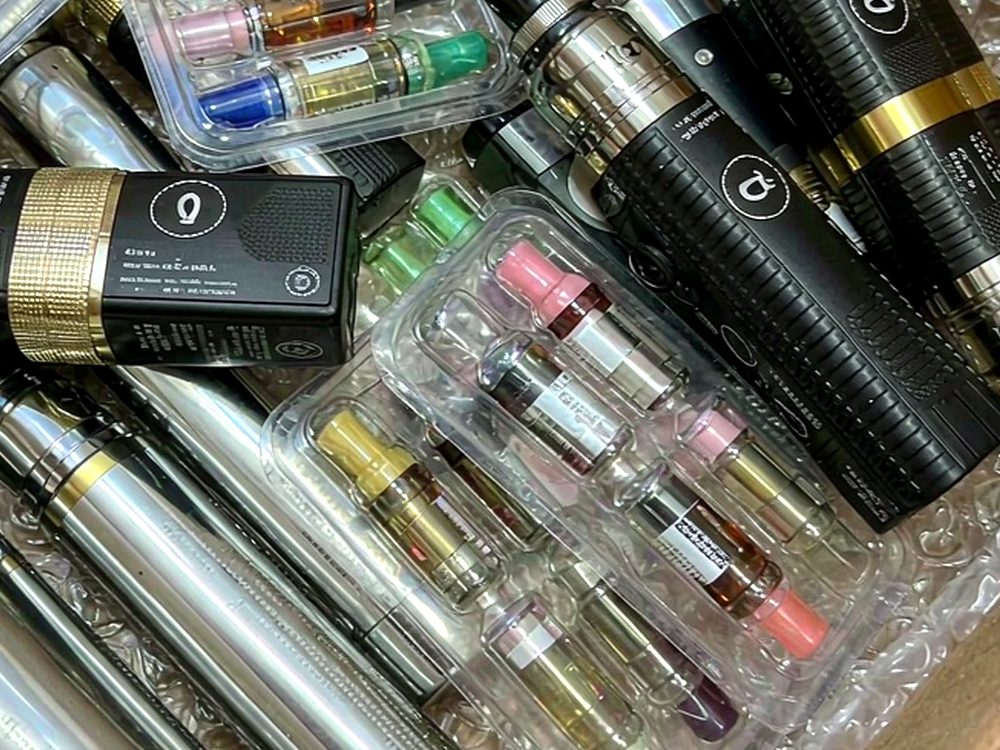 Restocking VapeCon products in Naples — premium tier